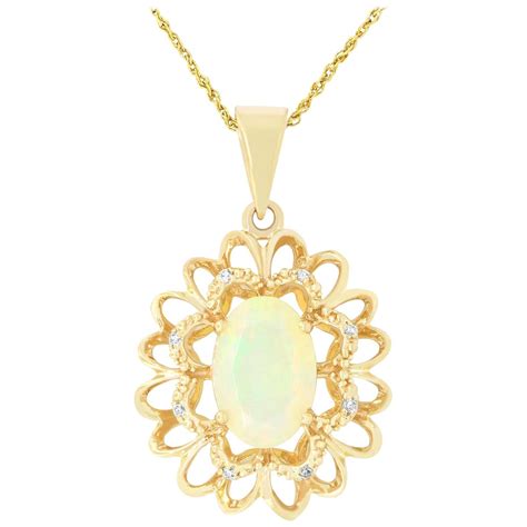 14 Karat Yellow Gold Necklace With Freeform Oval Opal And Gold Pendant