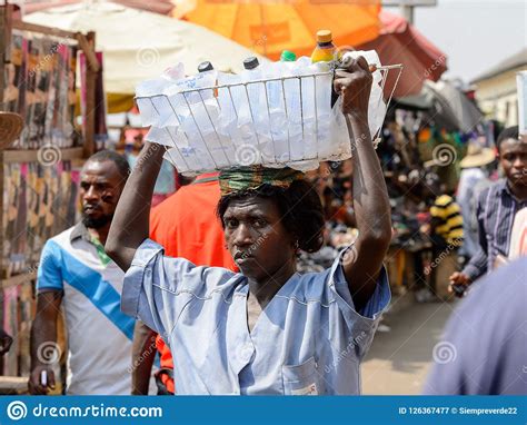 unidentified ghanaian woman carries a basket at the kumasi mark editorial photography image of