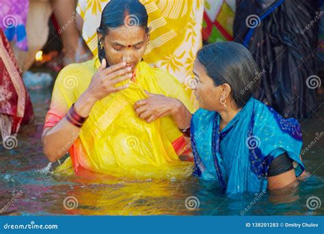 Pilgrims Bathe In Holy Ganges River At Sunrise In Varanasi India