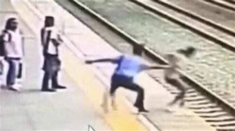 caught on camera heroic rail worker saves suicidal woman from jumping in front of train