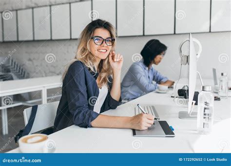 Beautiful Female Office Worker Carrying Out Administrative Work For