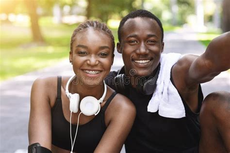 Self Portrait Of Cheerful Black Couple Posing For Photo After Training