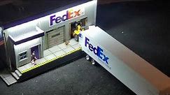Menards O Gauge FedEx Building and Tonkin Die Cast FedEx Tractor Trailer.