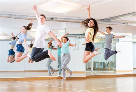 Group Of Young Dancers Jumping Together In Class Stock Photo Image Of