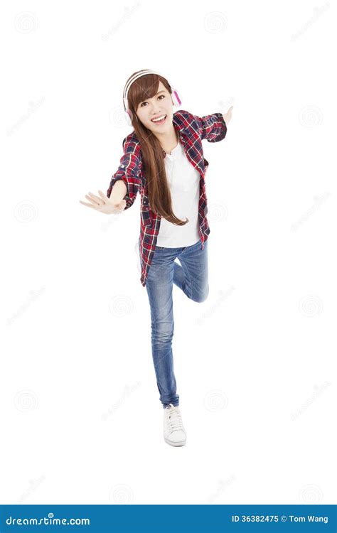 Young Woman With Headphones Listening Music And Dancing Stock Image
