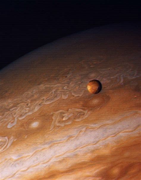 Image Of Jupiter And Its Moon Io Taken By Voyager 1 During Its Flyby