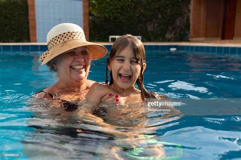 Grandmother And Grandson Having Fun In The Swimming Pool High Res Stock