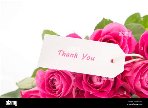 Close Up Of A Beautiful Bouquet Of Pink Roses With A Thank You Card On