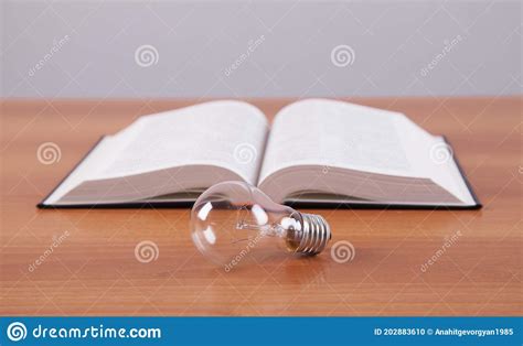 Knowledge And Wisdom Light Bulb And Book Stock Photo Image Of Open