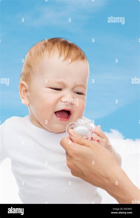 Crying Baby With Dummy Stock Photo Alamy