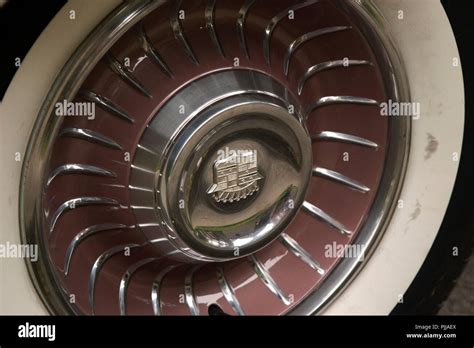 Close up of a hub cap from an antique vintage car. Tire of an