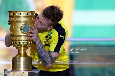 Marco Reus Of Dortmund Kisses The Dfb Cup Trophy After The Dfb Cup News Photo Getty Images