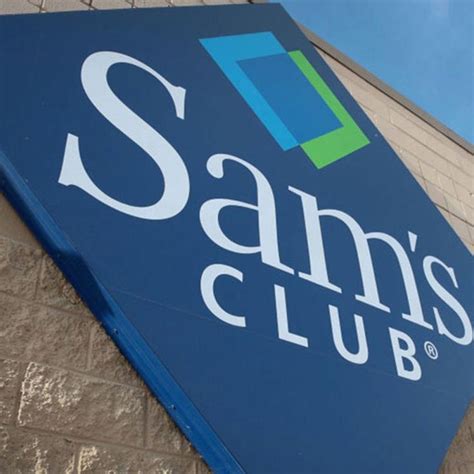 The Sams Club Sign Is Posted On The Side Of A Building In Front Of A