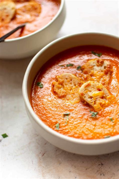 Nothing better than a bowl of tomato soup with some shredded cheddar cheese sprinkled on top and a grilled cheese sandwich. Tomato Basil Soup | The Recipe Critic