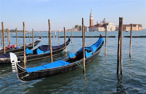 Gondolas And San Giorgio Maggiore Island In Venice Italy Stock Image