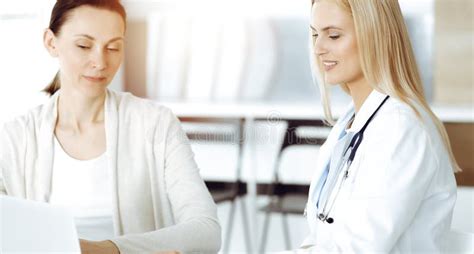 Woman Doctor At Work In Sunny Hospital Is Happy To Consult Female