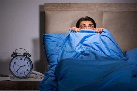 The Young Man Scared In Bed Stock Photo Image Of Insomnia Bedroom