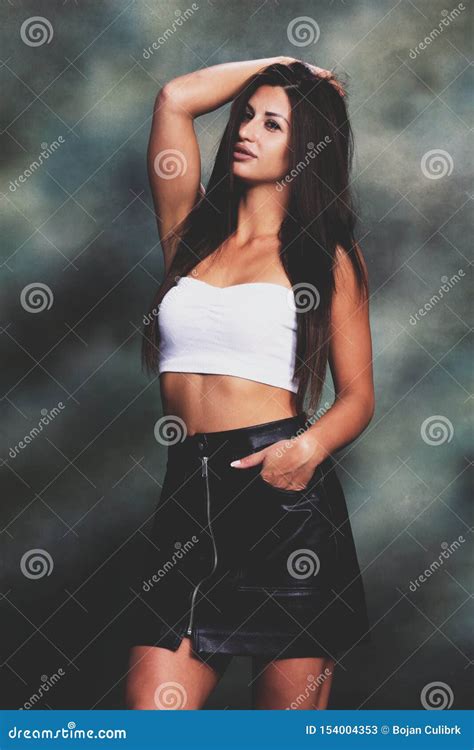 Beautiful And Attractive Brunette Girl Posing In Studio Stock Image