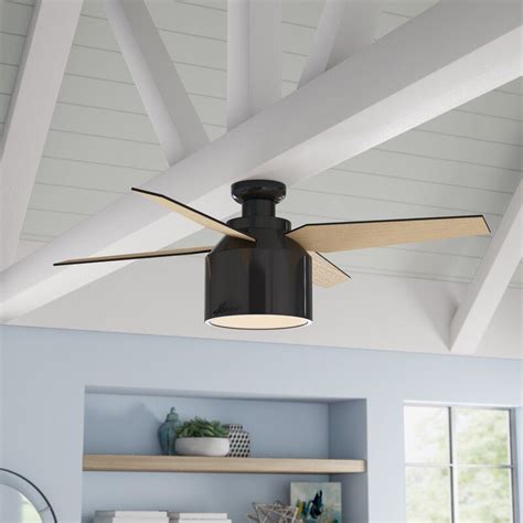 A Ceiling Fan That Is Mounted To The Ceiling In A Room With Blue Walls