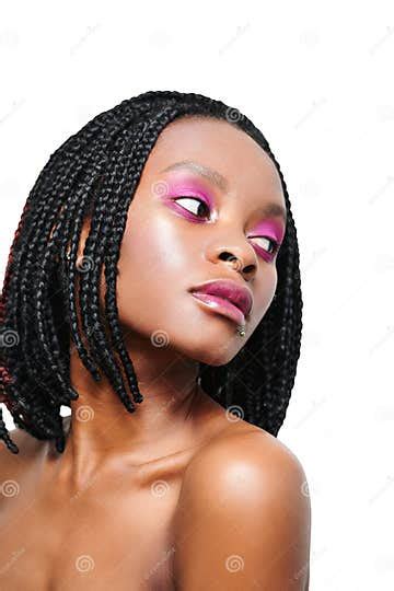 beauty portrait of an african american girl pink visage make up white background isolate