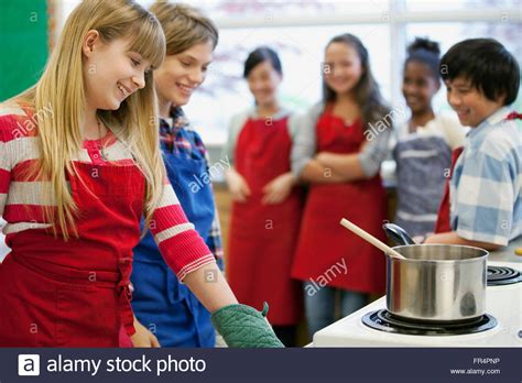 Middle School Students In Home Economics Class Stock Photo Royalty