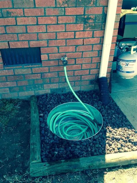 Build A Garden Hose Storage With Planter Diy Projects For Everyone