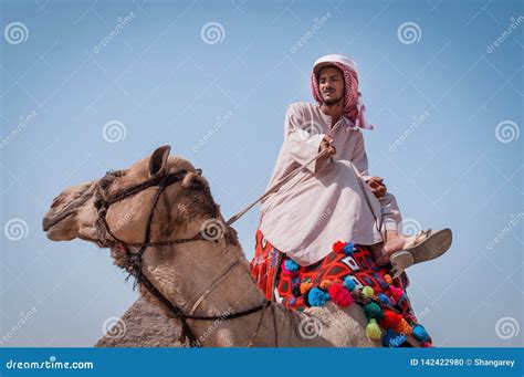 nomad with a camel in sahara desert editorial photo 131670681