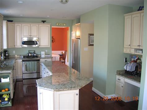 In this kitchen, the sage cabinets help to ground the lofty space while surrounding walls painted a soft. Loft sherwin williams softened green - idea for kitchen ...