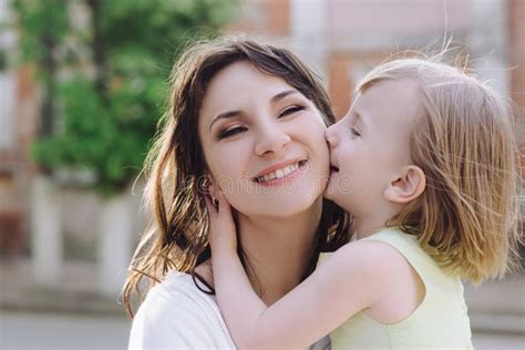 Portrait Young Mother With Her Daughter On The Nature Stock Photo