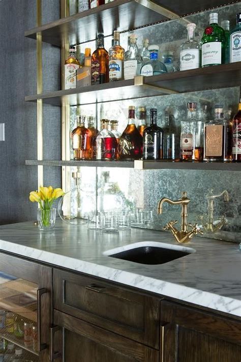 A backsplash of subway tile in foggy morning lustrously complements a wet bar's warm wood finishes and antiqued hardware. Pin by Toula Smyrniotis on LATIMER SPEAKEASY | Home wet ...