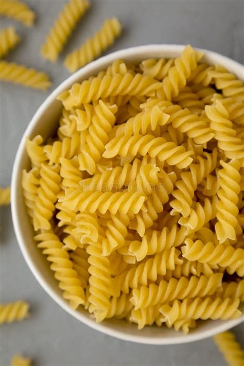 Uncooked Yellow Organic Rotini Pasta Side View Stock Photo Image Of