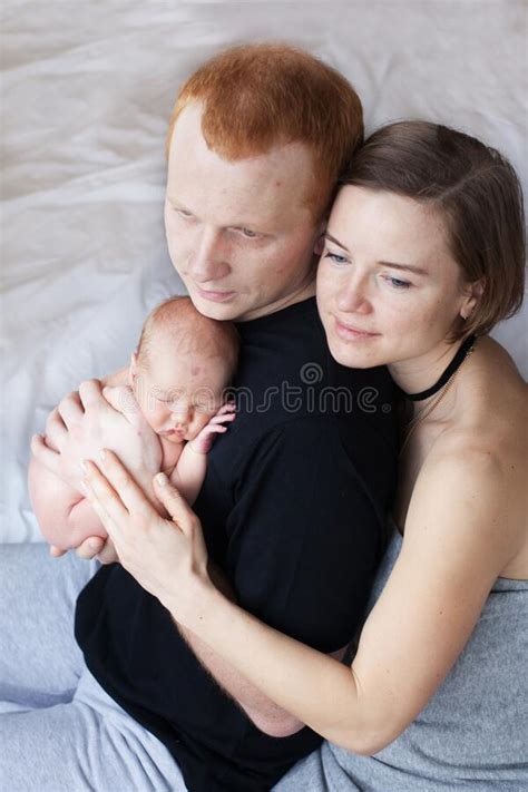 Parents Hug Their Newborn Baby Stock Photo Image Of Child Girl