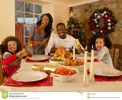 Why do many icelanders prefer to go to a restaurant and have boiled potatoes and fermented skate there? Family Having Christmas Dinner Stock Photo - Image: 20467670