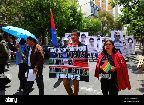 Protesters march to demand justice for the 43 missing students in