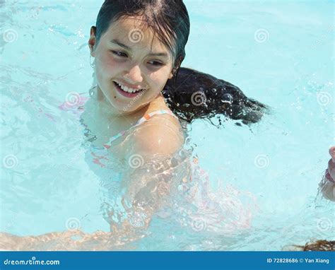 Teen Girl Playing And Smiling In Swimming Pool Stock Photo Image Of