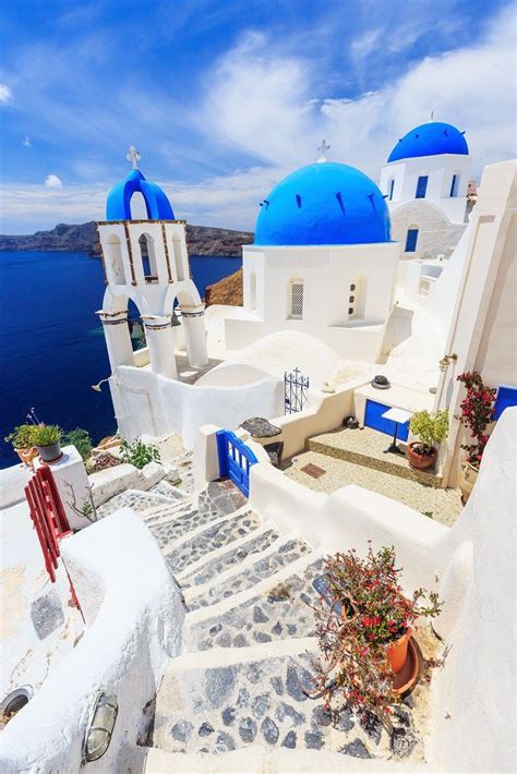 An Aerial View Of The Blue And White Buildings In Oia