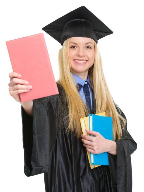 Smiling Woman In Graduation Gown Showing Book Stock Photo Image Of