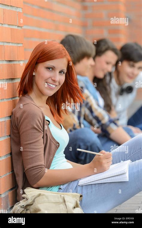Student Girl Sitting Outside Campus With Friends Stock Photo Alamy