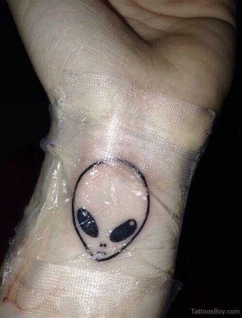 Alien Tattoo On Wrist Tattoo Designs Tattoo Pictures