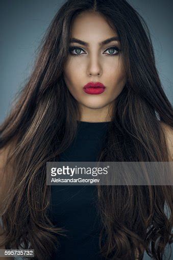 Fashion Portrait Of Beautiful Young Woman With Long Hair