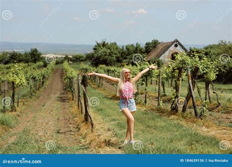 Young Blonde Woman Posing In The Vineyards In The Summer Season Outdoor Farmer Countryside