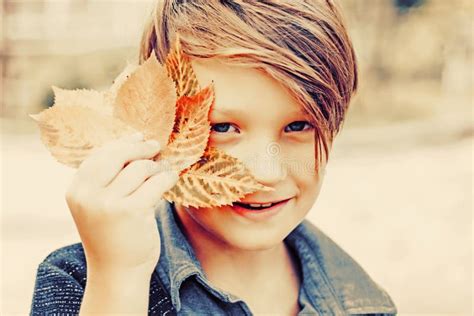 Boy On A Breeze In An Autumn Village Autumn Child With Autumnal Mood