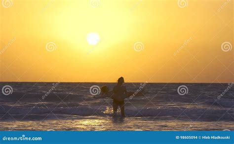 Romantic Couple Is Falling In Love On The Beach At Sunset Kiss Each