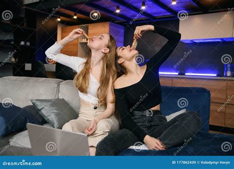 Two Women Having Fun At Home Opening Pizza Box Food Delivery Home