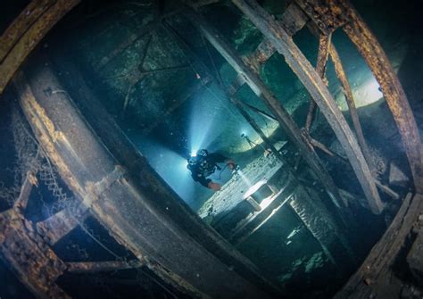 A Diver Exploring A Elevator Shaft In Flooded Mine Rsubmechanophobia
