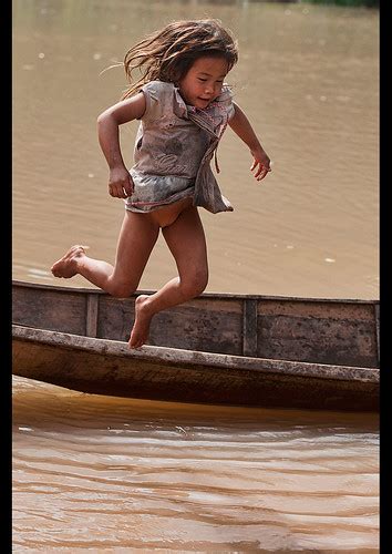 lanten girl jumping out of her dugout canoe on the nam ha … flickr