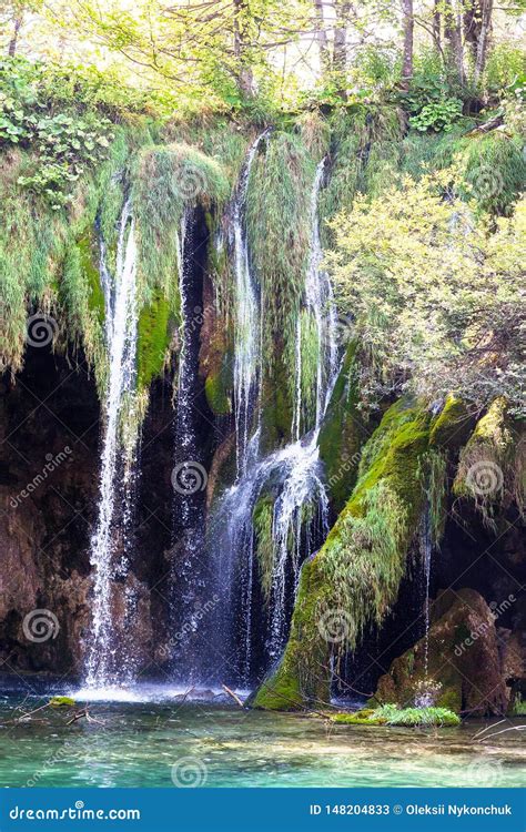 Water That Falls From A Large Waterfall Over Stone Slopes Plitvice