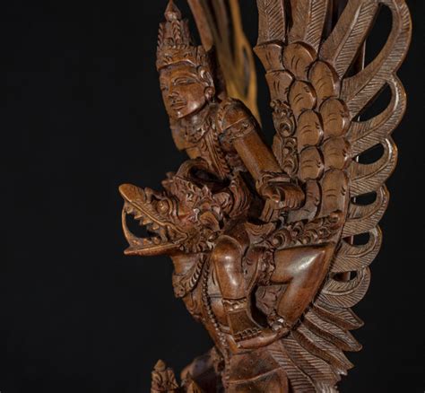 Wood Carving Of Garuda With Vishnu On His Back With Three Nagas And A