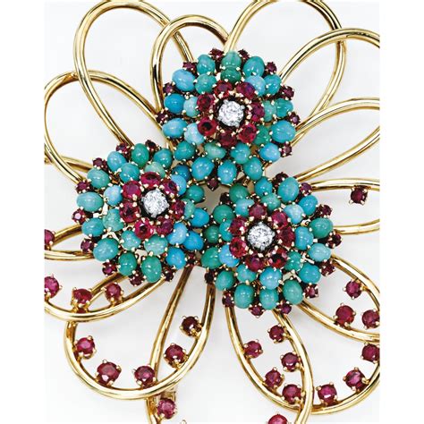 18 karat gold diamond ruby and turquoise brooch and earclips john rubel the brooch of swirled