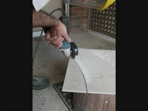 Remove the toilet and tile up to the drain. Cutting a Freehand Curve in a Glazed Tile - YouTube